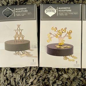 Magnetic sculpture, money, tree, and people